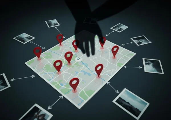 A map with pins appearing from digital photo files, showing risk